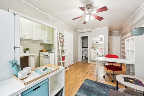A small kitchen with a table and chairs.